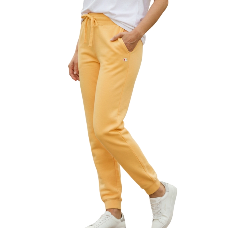 Spodnie dresowe Champion 115411 Ciemny żółty Model